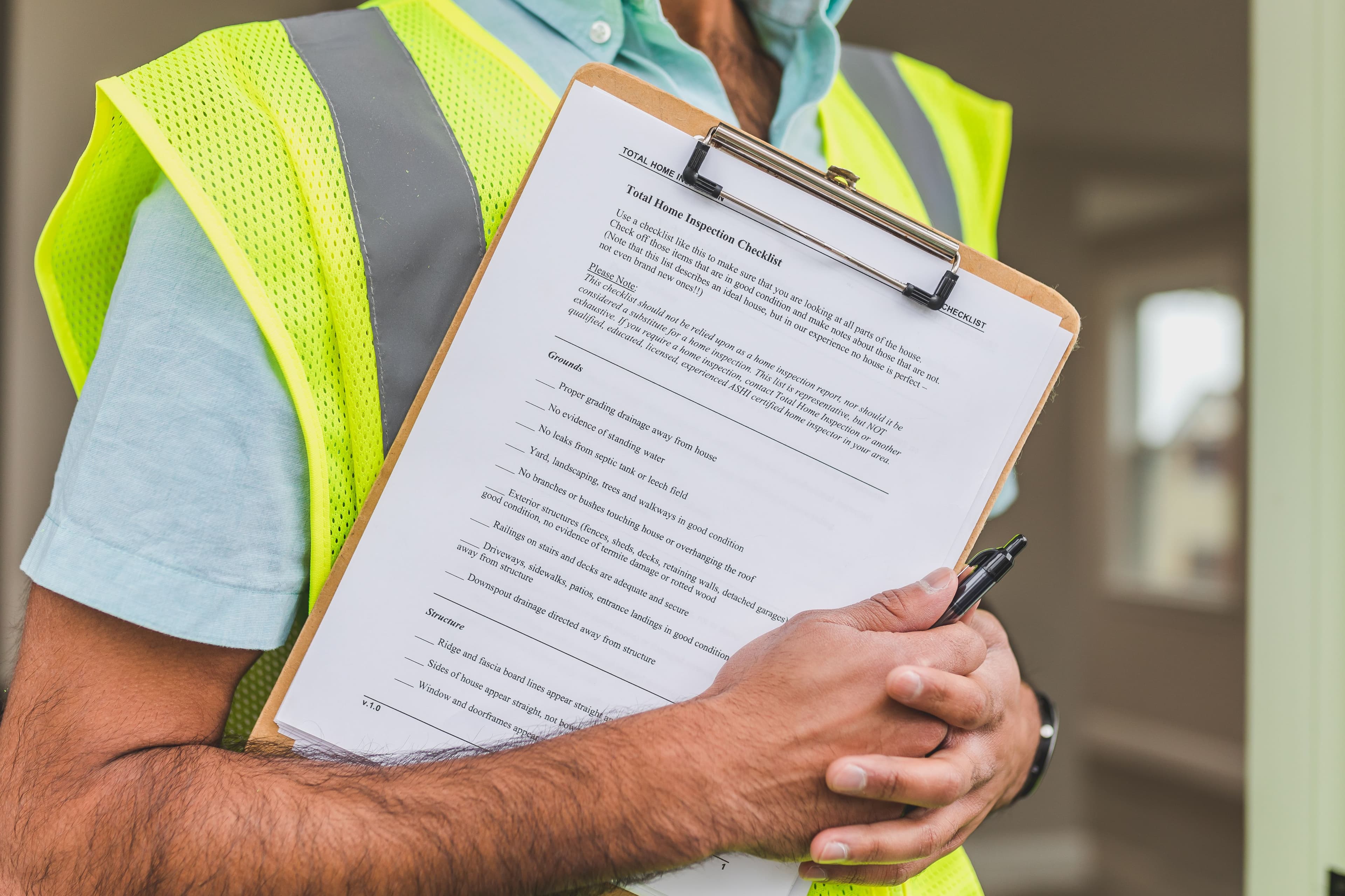 Technician reviewing a maintenance checklist during a home visit