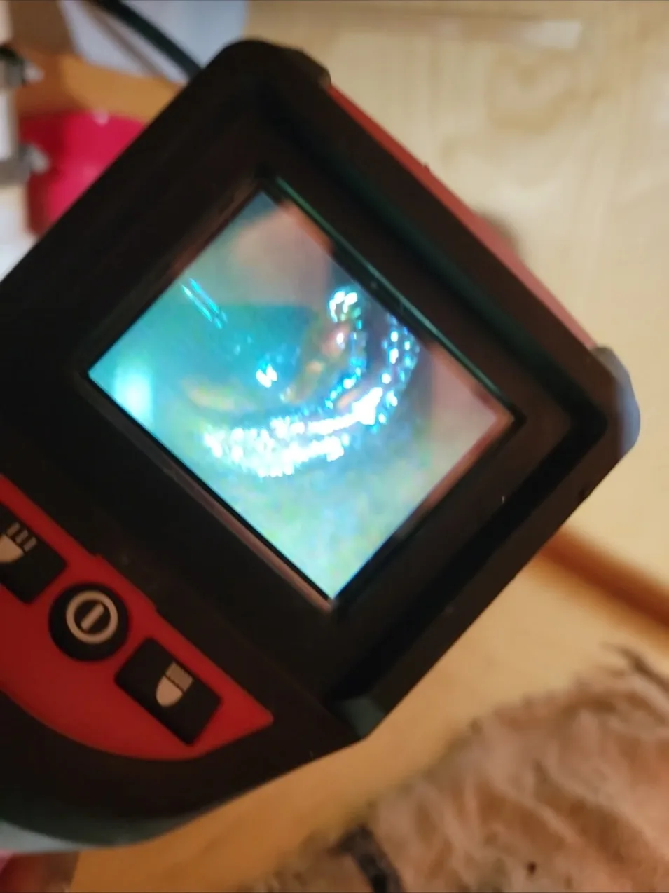 Sewer inspection camera monitor displaying a live view inside a pipe